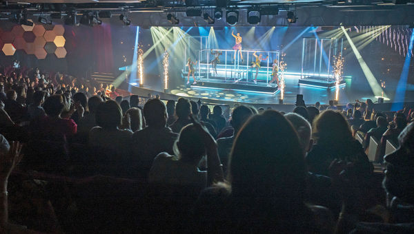 The show is performed in the ship's auditorium-style World Theatre.