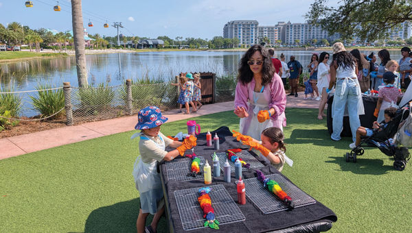 Hotels editor Christina Jelski helps her two kids make tie-dye T-shirts at Disney's Caribbean Beach Resort. Hotels editor Christina Jelski helps her two kids make tie-dye T-shirts at Disney's Caribbean Beach Resort.