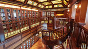 Cunard's Queen Victoria library features elegant two-story design, rich wood paneling and a stained-glass ceiling.