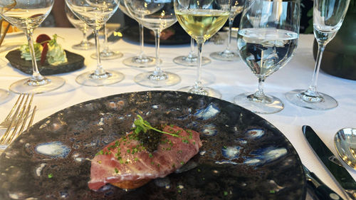 The first course: focaccia topped with tuna, foie gras and caviar. The first course: focaccia topped with tuna, foie gras and caviar.