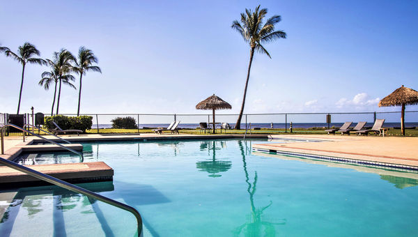 A pool sits oceanfront at Waimea Plantation Cottages. A pool sits oceanfront at Waimea Plantation Cottages.