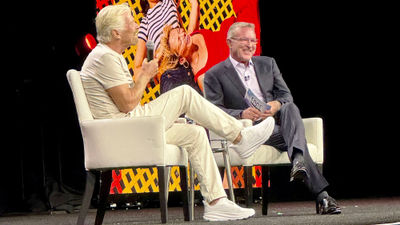 Travel Leaders Network president John Lovell, right, speaks with Richard Branson, founder of Virgin Group, on stage during the network’s Edge conference at Caesars Palace Las Vegas Hotel and Casino.