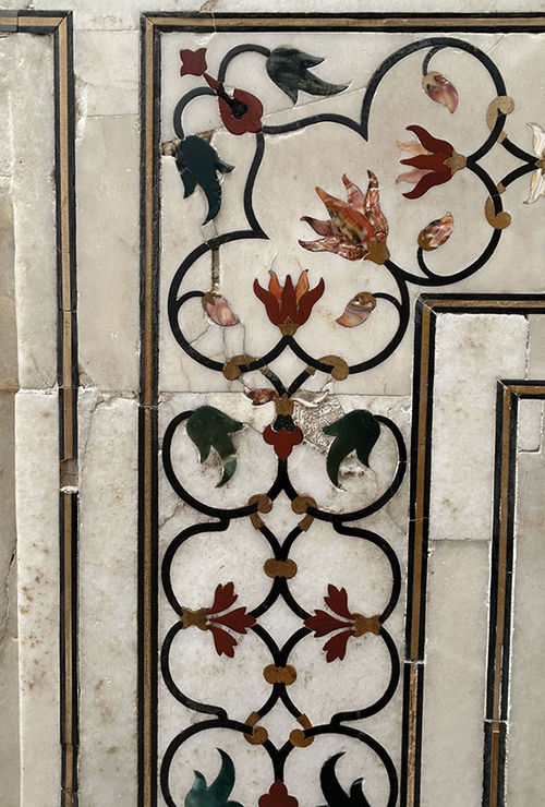 Complex stone was inlaid in marble near TAJ Mahal entrance.