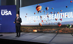 Brand USA chief Fred Dixon at the IPW conference in June unveiling the organization's new marketing campaign. The U.S. Senate has proposed cutting federal funding for Brand USA from $100 million to $20 million in 2026.