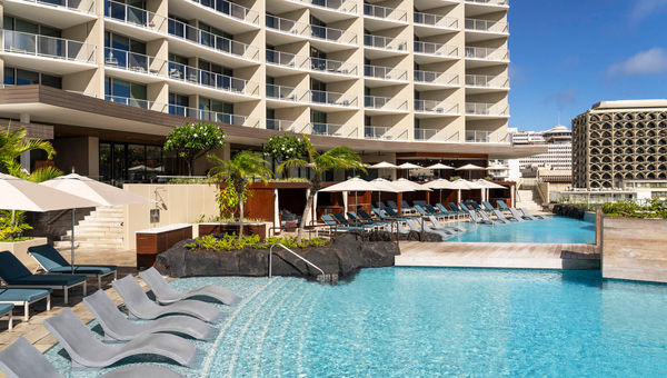 Several stories above Waikiki, the resort’s infinity pools offer a quiet place to lounge. Several stories above Waikiki, the resort’s infinity pools offer a quiet place to lounge.
