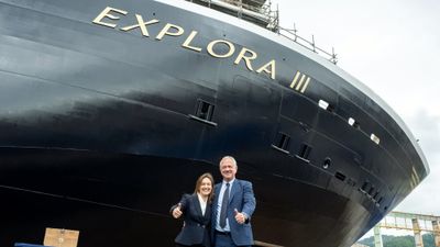 Explora Journeys president Anna Nash and MSC Cruises executive chairman Pierfrancesco Vago in front of the Explora III in Genoa, Italy