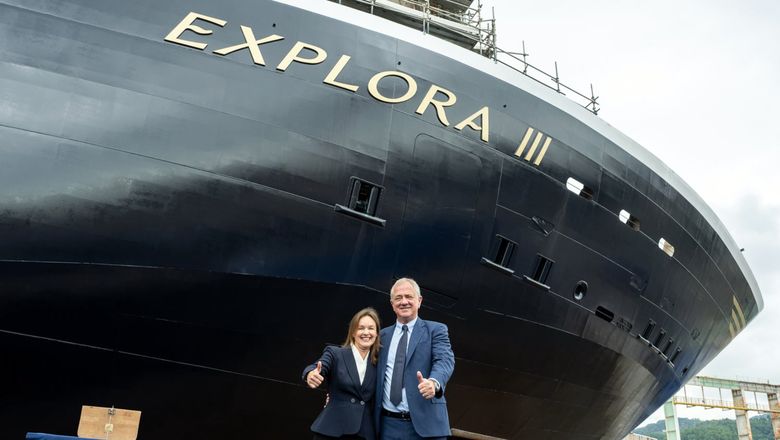 Explora Journeys president Anna Nash and MSC Cruises executive chairman Pierfrancesco Vago in front of the Explora III in Genoa, Italy
