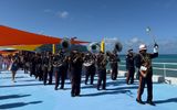 A Bahamian band paraded the pier at Celebration Key's grand opening.