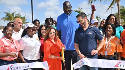 Carnival Cruise Line president Christine Duffy cuts the ribbon on Celebration Key. Brand ambassador Shaquille O'Neal and Carnival Corp. CEO Josh Weinstein look on.