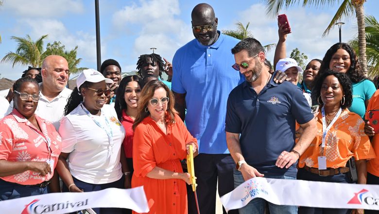 Carnival Cruise Line president Christine Duffy cuts the ribbon on Celebration Key. Brand ambassador Shaquille O'Neal and Carnival Corp. CEO Josh Weinstein look on.