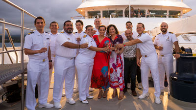 Lindblad Expeditions senior vice president of hotel operations Ana Esteves and CEO Natalya Leahy, center, were joined by senior officers, including the captains of the National Geographic Gemini and Delfina, at the ships' naming ceremony.