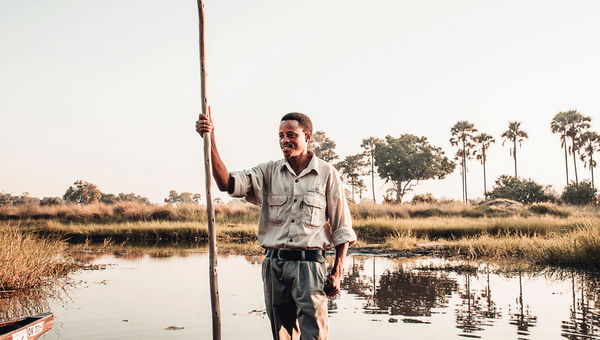 KAZA's mokoro safaris enable travelers to paddle traditional dugout canoes across international waters, from Botswana into Namibia, without leaving their boat.