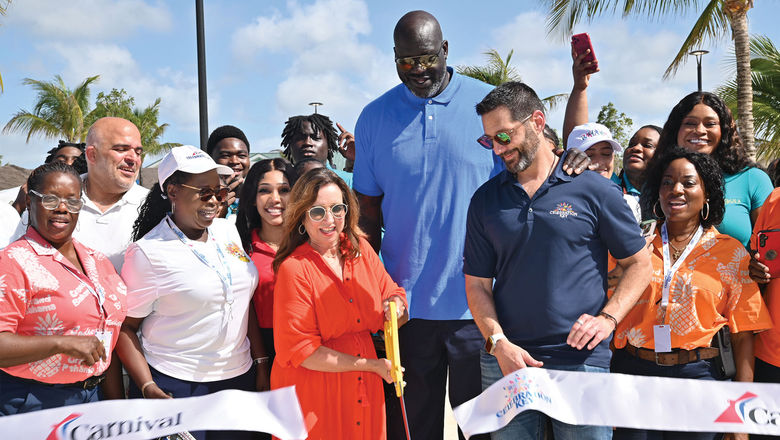 Brand ambassador Shaquille O'Neal joins Carnival Cruise Line president Christine Duffy and Carnival Corp. CEO Josh Weinstein at the ribbon cutting for Celebration Key.