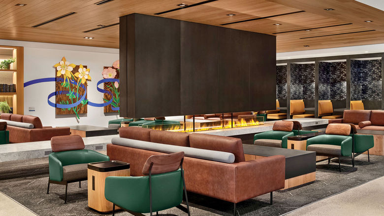 United says its newly reopened United Club on Denver's B Concourse has been renovated to evoke the feeling of a cabin in the Rockies.