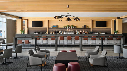 One of two bars at the renovated Denver United Club on Concourse B west. One of two bars at the renovated Denver United Club on Concourse B west.