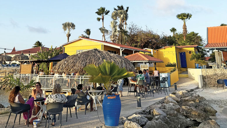 The Pureocean Beachside Bar is an outdoor spot near the cruise terminal where guests can order a drink and go for a swim.
