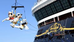 A Mickey statue being added to the Disney Adventure's stern earlier this year. Disney Cruise Line said it will delay the ship's debut until March.
