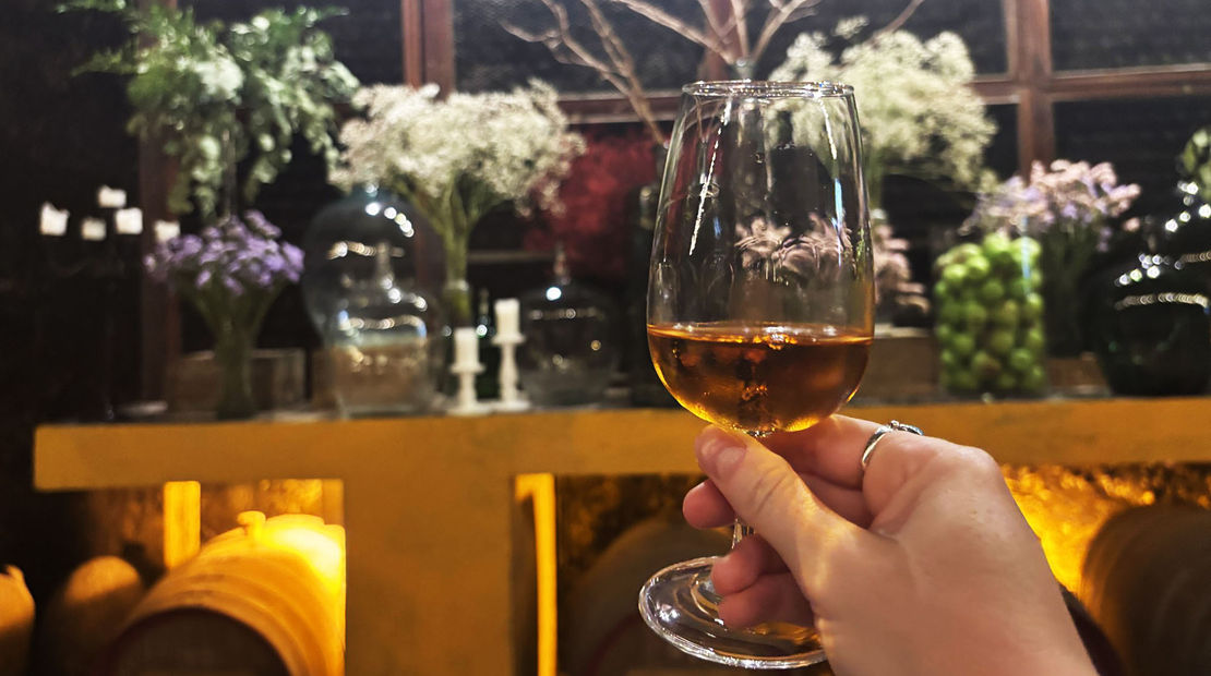 Enjoying a glass of white port at the Quinta da Pacheca vineyard in Cambres, Portugal.
