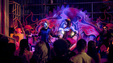 Jack the Clown and sidekick Chance interact with the crowd in Jacks Alley at Universal Horror Unleashed.