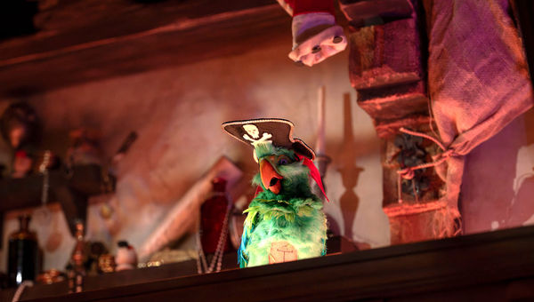 Rummy the parrot entertains guests inside the Beak and Barrel.