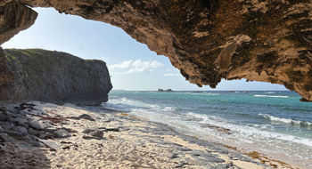 The secret beaches and caves at Mudjin Harbour are just a short stroll from the Dragon Cay Resort on Middle Caicos.