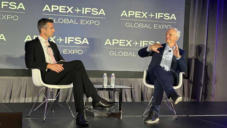 Ben Thompson of the BBC (left) interviewing Breeze Airways CEO David Neeleman at the Airline Passenger Experience Association Global Expo.