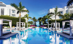 Wymara Resort + Villas has two locations on Turks and Caicos' main island of Providenciales. Pictured, the pool at the resort with its poolside cabanas.