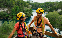 A scene from Visit Florida's “Live More Floridays” campaign: a couple at the Canyons Zipline and Adventure Park in Ocala.