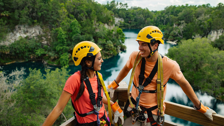 A scene from Visit Florida's “Live More Floridays” campaign: a couple at the Canyons Zipline and Adventure Park in Ocala.