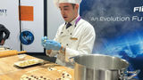 Turkish Airlines chef Demir Duzel demonstrates how to prepare manti at the IFSA trade show.