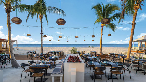 Wymara Villas + Beach Club's beachfront Blue Water Bistro, where the cuisine reflects various parts of the Caribbean.
