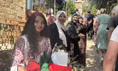 Women employed by Beit Khayrat Souf in Souf, Jordan, greet G Adventures travelers at the restaurant. It was founded in 2016 with the goal of employing women who live in the region.