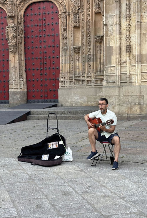 A busker performs in Salamanca’s Old City. A busker performs in Salamanca’s Old City.