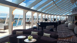 A seating space in the Yacht Club section of the MSC World America. The Yacht Club will be introduced on the MSC Poesia in 2026.