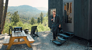 TV personality and outdoorsman Dylan Efron at a Postcard Cabin accommodation, which is now part of the new Outdoor Collection by Marriott Bonvoy.