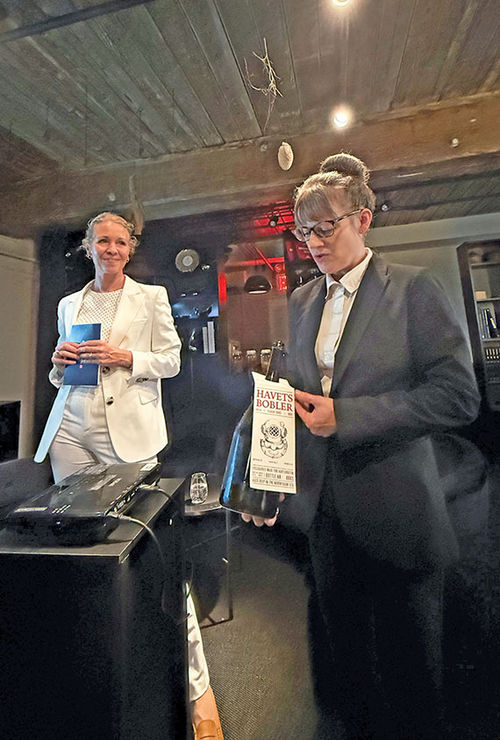 Hurtigruten CEO Hedda Felin, left, at Scandinavian restaurant Aska in New York. She brought the bottle of Hurtigruten house sparkling wine after it was removed from the Artic Sea the week prior. It had been underwater for a year. Hurtigruten CEO Hedda Felin, left, at Scandinavian restaurant Aska in New York. She brought the bottle of Hurtigruten house sparkling wine after it was removed from the Artic Sea the week prior. It had been underwater for a year.