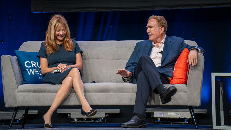 Vicki Freed, Royal Caribbean's senior vice president of sales and trade support and services, on stage at CruiseWorld with Royal Caribbean Group chairman Richard Fain.