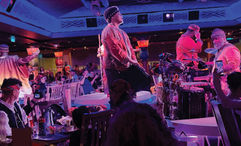 Performers in Pride Lands: Feast of the Lion King.