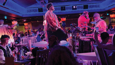 Performers in Pride Lands: Feast of the Lion King.