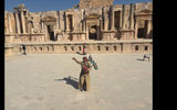 A man plays a a Jordanian bag pipe in the amphitheater of the Jerash ruins.