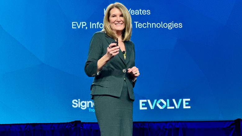 Karen Yeates, Signature Travel Network’s executive vice president of information technologies, on stage Signature's annual conference.
