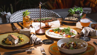 Ko restaurant reopens following redesign with family-style dishes.