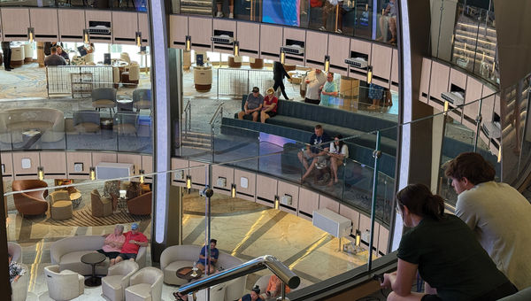 Star Princess passengers relaxing in the Piazza, the ship's atrium.