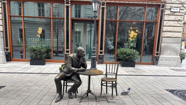 A statue located near cafes in Budapest signals the importance of historic coffeehouse culture for the city's intellectuals and literary community. A statue located near cafes in Budapest signals the importance of historic coffeehouse culture for the city's intellectuals and literary community.