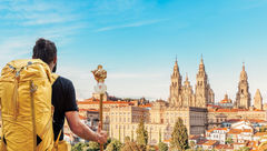 A pilgrim reaches the end of his journey to Camino de Santiago in Santiago de Compostela, Spain.