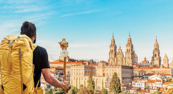A pilgrim reaches the end of his journey to Camino de Santiago in Santiago de Compostela, Spain.