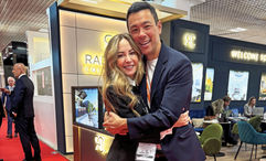 Luxury travel advisor Stacy King hugs Access Italy’s Simone Amorico at the International Luxury Travel Market.