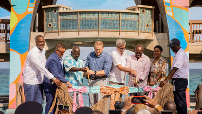 Royal Caribbean Group executives and Bahamian officials cut the ribbon on Royal Beach Club Paradise Island.