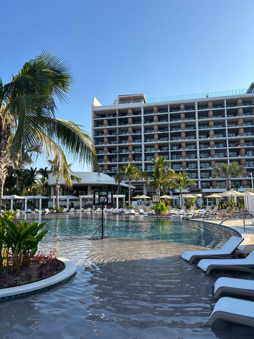 The main pool area at Unico 20º 105º anchors the resort's social scene.