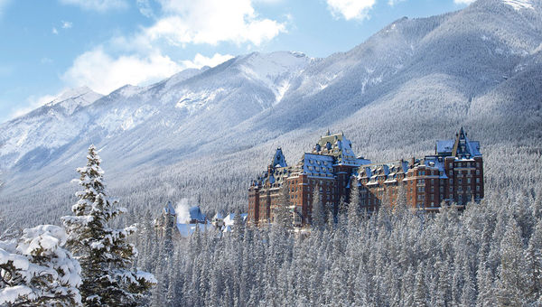The Fairmont Banff Springs sits on the edge of Banff town, tucked into the pine-covered mountainside.